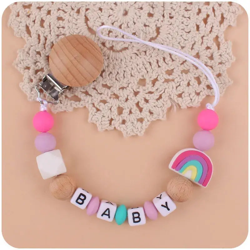 Attache tetine - Attache sucette - Arc en ciel Mon Shopping Bébé