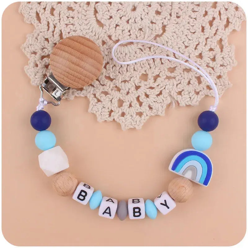 Attache tetine - Attache sucette - Arc en ciel Mon Shopping Bébé